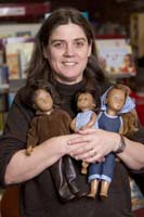 Colour photograph of the upper profile of Gaby Spinks holding her Sasha dolls.