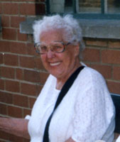 Colour photograph of the head and shoulders of Annie Neal.