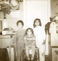 Sepia photograph of Asma Khursid and siblings as children.