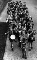 Black and white photograph of Firshill Percussion Band marching, 1936.