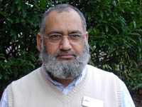 Colour photograph of the head and shoulders of Rashid Ahmed.