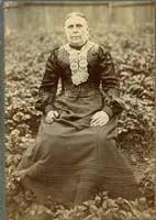 Sepia portrait photograph of Elizabeth Williams sitting down.