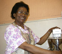 Colour photograph of Collis Beckford beside her cake mixer.