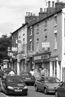 Black and white photograph of shops along Barnsley Road.