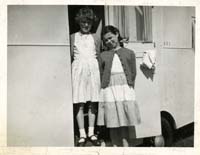 Black and white photograph of Janet Boam and friend as children at the family caravan.