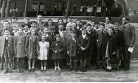 Black and white photograph of children on a trip with Pitsmoor Working Men's Club.