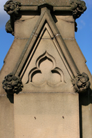 Colour photograph of a carved stone gatepost at the entrance to Burngreave Cemetery