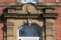 Colour photograph of the front door of the Saddiqia mosque showing the lintel above the door