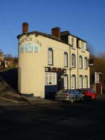 Colour photograph of a painted scene on the exterior wall of The Grapes Public House on Gower Street