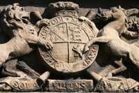 Colour photograph of a carved stone panel above one of the Wicker Arches