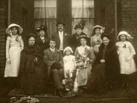 Sepia photograph of Alice Ingham's family at her wedding, 1914.