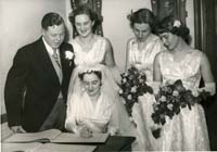 Black and white wedding photograph of Sylvia and Neville Hart and witnesses, 1954.