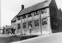 Black and white photograph of the exterior of the original St Catherines Primary School