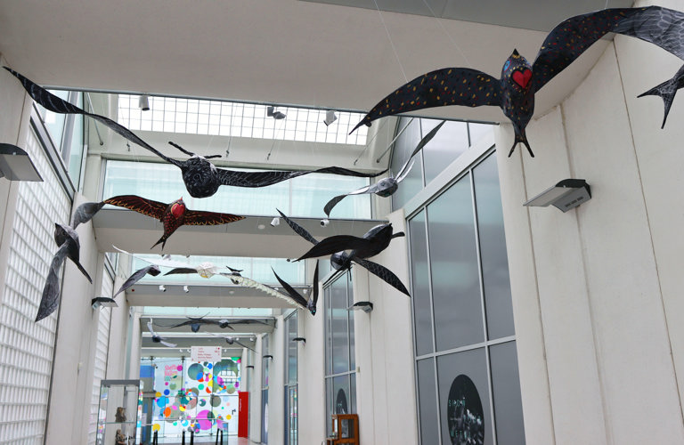 Large scale paper-mache swifts hung from the ceiling in the main thoroughfare of the Millennium Gallery.