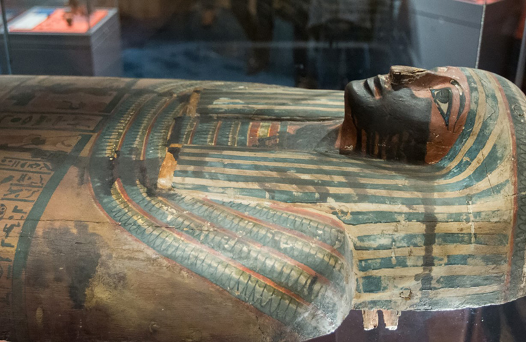 The top half of a painted Egyptian sarcophagi.