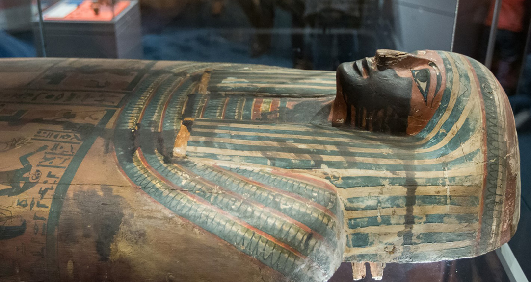 The top half of a painted Egyptian sarcophagi.