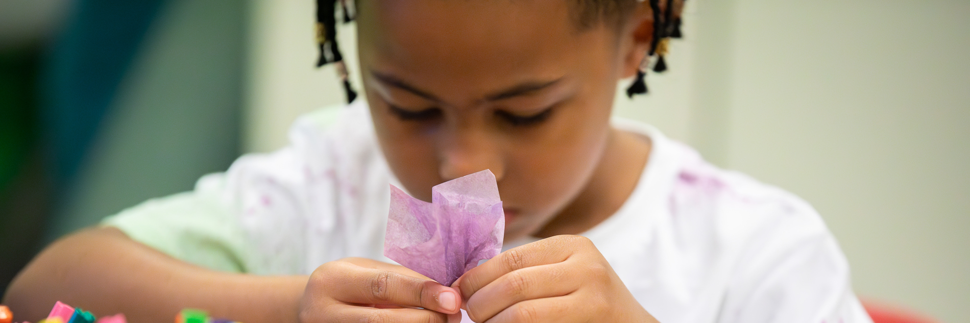 A child taking part in craft activities.