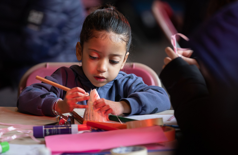 A child taking part in craft activities.