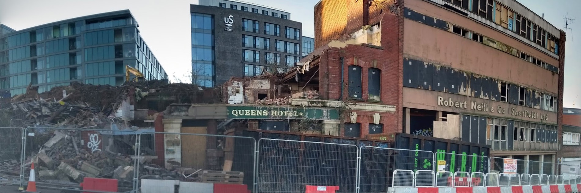 A photograph of a partly demolished building. 