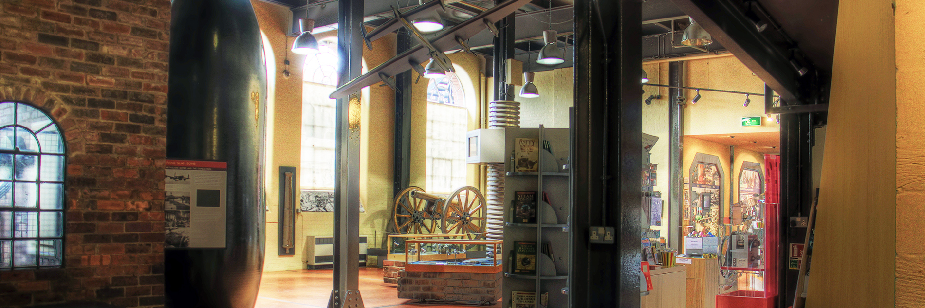 A very large bomb standing vertically on display in the Museum entrance hall.