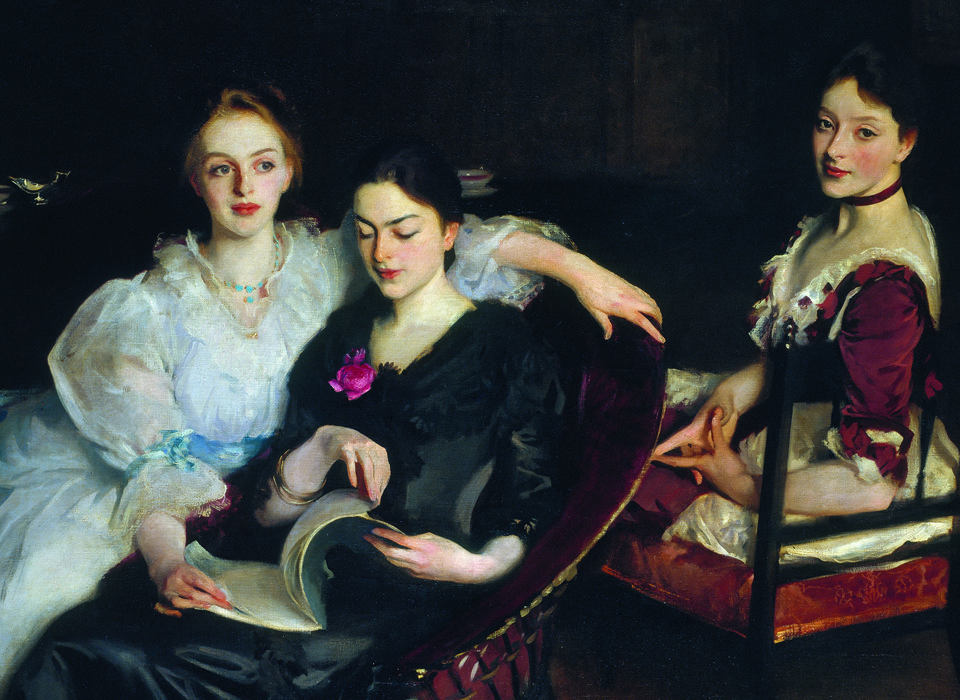 An oil painting of three women in formal Victorian dress. They are sitting informally next to each other - two women are sharing a chair and looking at a book, and the third woman is sitting on a chair behind them. The painting has a dark background, with the outline of a dresser on which sits a silver jug and a porcelain bowl. 
