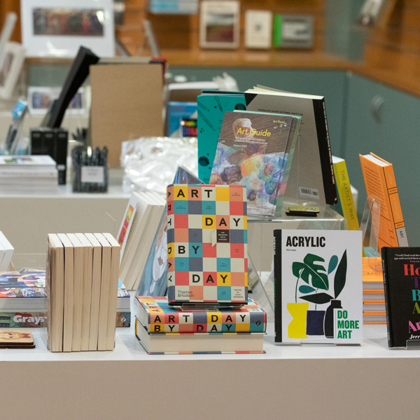 A museum shop display of art books and stationery items