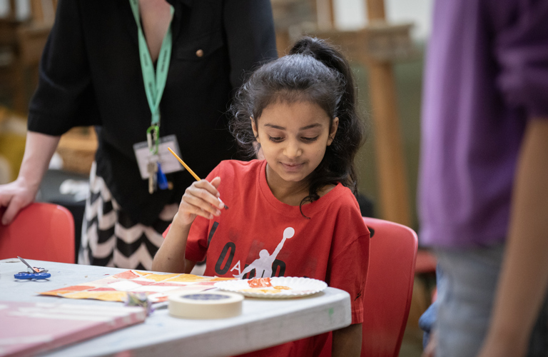 A child taking part in art activities.