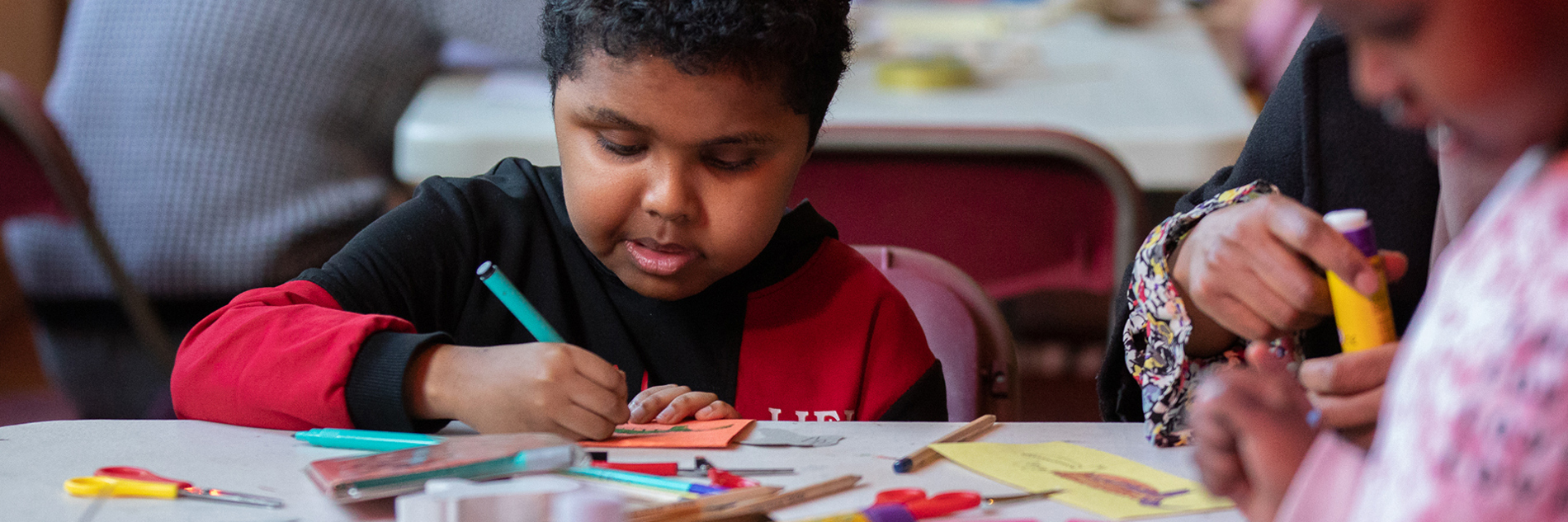 A family taking part in a craft activity.