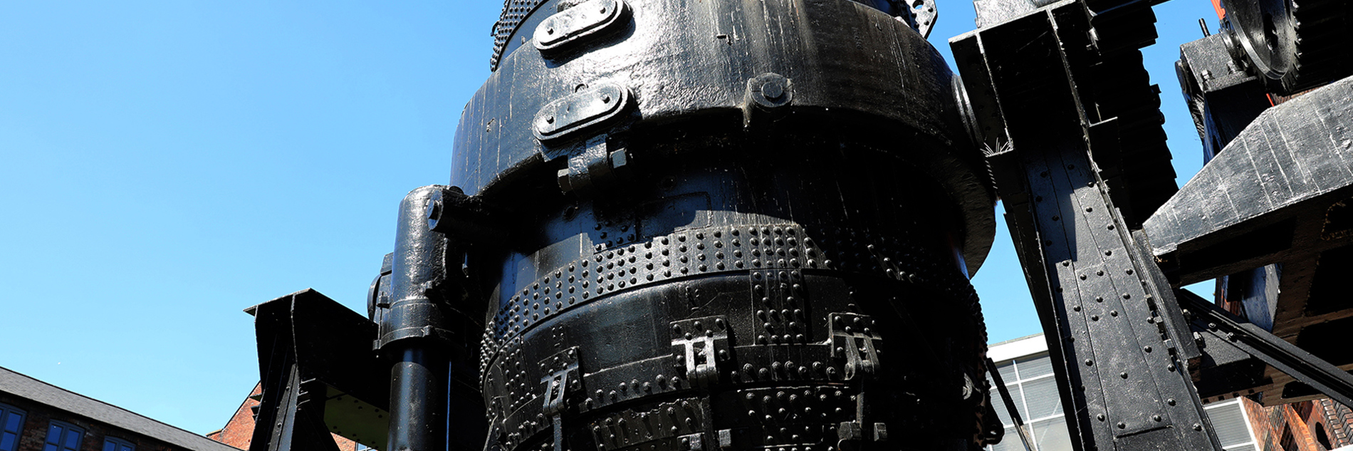 A view of a decommissioned Bessemer Converter against a backdrop of the Kelham Island Museum