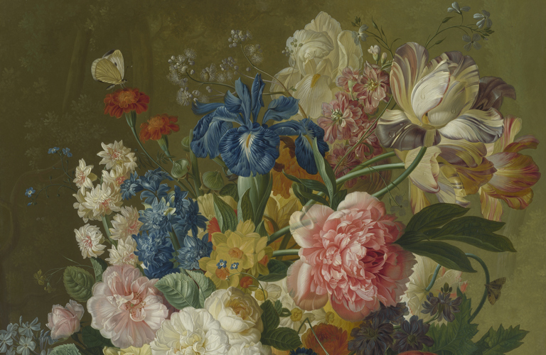 A teeming array of flowers including pink carnations and blue irises arranged in a vase against a muted green background