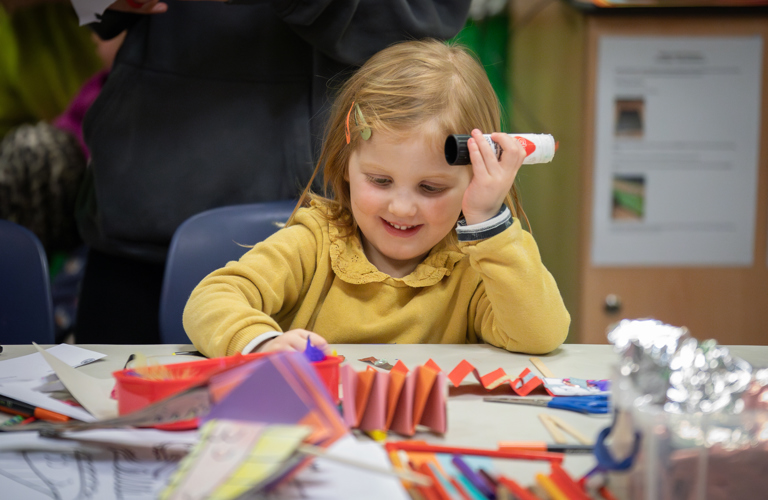 A child taking part in craft activities.