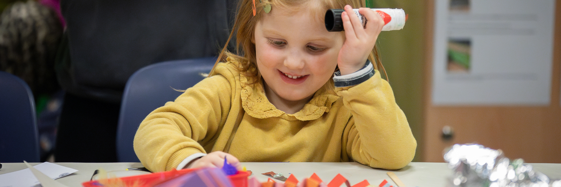 A child taking part in craft activities.